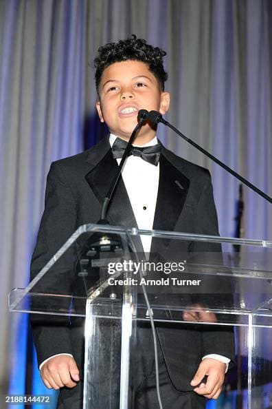Collins Eromo speaks onstage at the 2024 Illuminate Life Gala